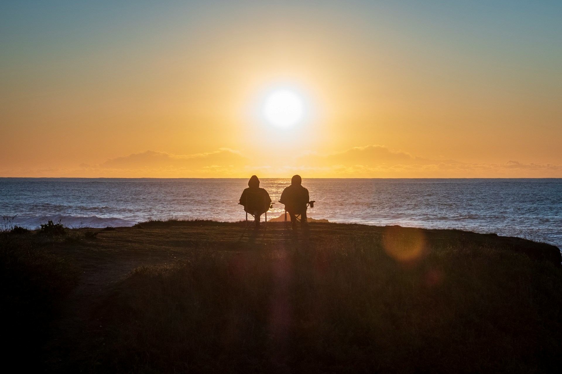 A path leading to a beautiful beach sunset, symbolizing the path to retirement.